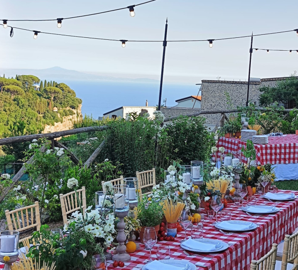 Colorful table setting with Mediterranean decorations for a convivial dining experience on the Amalfi Coast